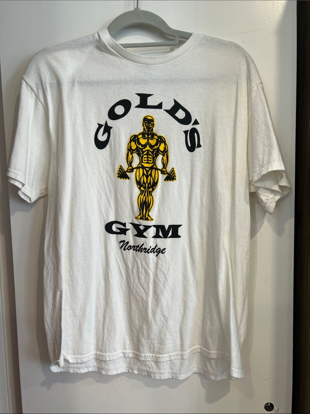 Delta White Short Sleeve Tee with Black and Yellow Gold's Gym Graphic